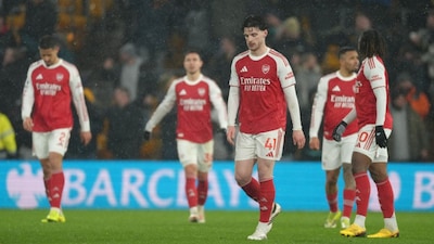 Arsenal team react during the Premier League soccer match between Wolverhampton Wanderers and Arsenal in Wolverhampton, England, Wednesday, Feb. 18, 2026. (AP Photo/Dave Shopland)