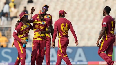West Indies' Matthew Forde, right, celebrates the wicket of Italy's Gian Piero Meade during the T20 World Cup cricket match between West Indies and Italy in Kolkata, India, Thursday, Feb. 19, 2026. (AP Photo/Bikas Das)