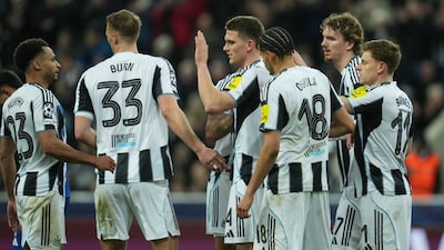 Newcastle platers celebrate after a goal during the Champions League second leg playoff match between Newcastle and Qarabag in Newcastle, England, Tuesday, Feb. 24, 2026. (AP Photo/Jon Super)