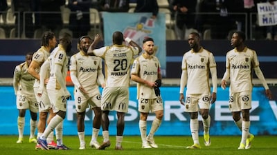 Lens' players celebrate after the French League One soccer match between Paris FC and Lens in Paris, Saturday, Feb. 14, 2026. (AP Photo/Michel Euler)