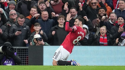 Manchester United's Bruno Fernandes celebrates after scoring during the English Premier League soccer match between Manchester United and Tottenham in Manchester, England, Saturday, Feb. 7, 2026. (AP Photo/Jon Super)