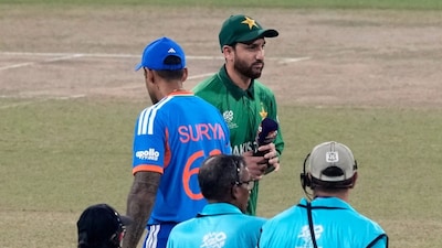 India's captain Suryakumar Yadav, left, and Pakistan's captain Salman Ali Agha walk past each other after the coin toss of the T20 World Cup cricket match between India and Pakistan in Colombo, Sri Lanka, Sunday, Feb. 15, 2026. (AP Photo/Eranga Jayawardena)