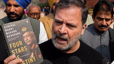 A printed copy of the unpublished book by former Indian Army chief Gen MM Naravane held up in the Parliament complex by Congress leader Rahul Gandhi. (Image: PTI/File)