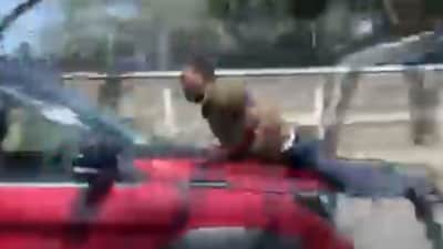 In the heat of the moment, the goods vehicle driver allegedly climbed onto the bonnet of the car. Enraged, the car driver is said to have sped away, dragging the man along for nearly a kilometre. (News18)