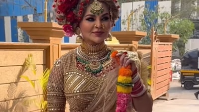 Rakhi Sawant spotted with bridal makeup and a varmala in hand.