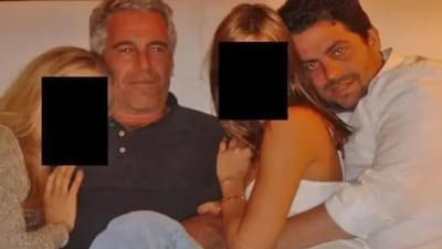 'Melania' Director Brett Ratnar appears to be embracing a young woman in the latest image released by the US Department of Justice
