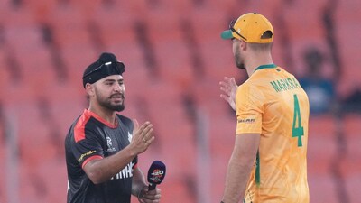Dilpreet Bajwa shakes hands with South Africa's captain Aiden Markram (Picture credit: AP)