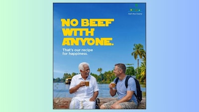 The poster, shared across all of Kerala Tourism’s social media platforms, features an elderly man and a foreigner sitting together, sipping tea. (Image via X/@KeralaTourism)