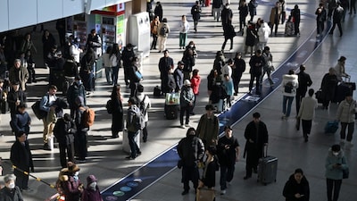 People walk through a train station in Seoul. (AFP file photo)