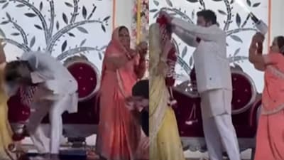 Guests duck as grandmother fires a pyro gun during the varmala ceremony.(Photo Credit: Instagram)