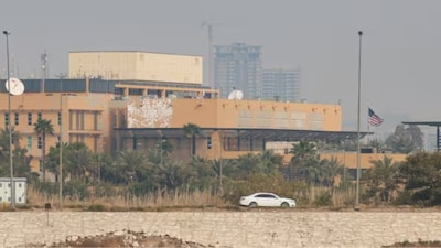 A car moves past the US Embassy in Baghdad on March 14, 2026. (Image: Reuters)