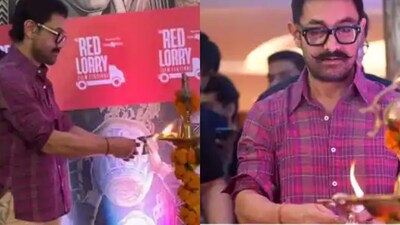 Aamir Khan lights the ceremonial diya at the Red Lorry Film Festival in Mumbai.