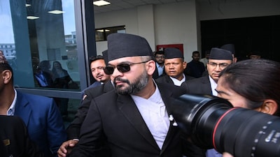 Rastriya Swatantra Party (RSP) leader Balendra Shah (C) arrives to take oath during a swearing-in ceremony at the parliament in Kathmandu on March 26, 2026.