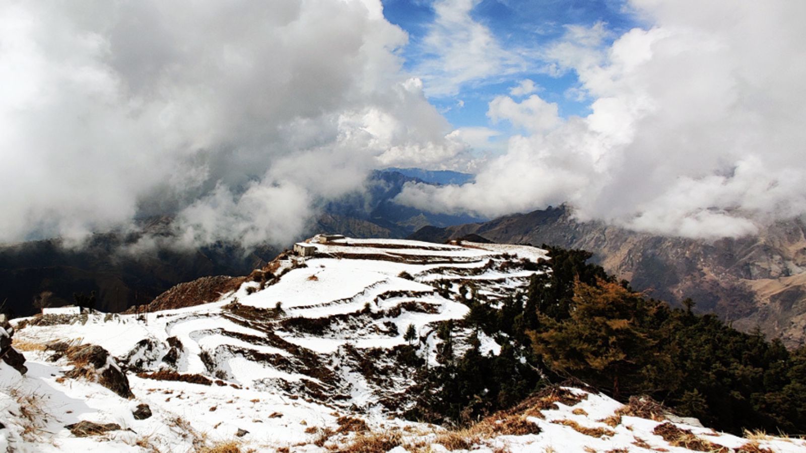 Chakrata, UttarakhandChakrata is a secluded high-altitude haven located about 90 km from Dehradun, perfect for those who want to completely disconnect. The most iconic attraction here is Tiger Falls, one of the highest direct-fall waterfalls in the country, reached via a short trek through lush deodar forests. You can also explore Chilmiri Neck, a flat plateau offering the best sunset views in the region, or drive to Kanasar to see some of the oldest and largest Deodar trees in Asia. For the more adventurous, the Budher Caves (Miola Caves) offer a unique limestone stalactite and stalagmite exploration experience.