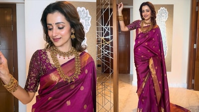 Trisha Krishnan at Eka Lakhani and Ravi Bhagchandika’s wedding reception in Mumbai, wearing a purple Kanchipuram silk saree paired with traditional antique gold temple jewellery.