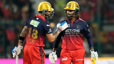 Royal Challengers Bengaluru's Virat Kohli, left, and batting partner Rajat Patidar chat during IPL 2026's opening match against SRH (AP)