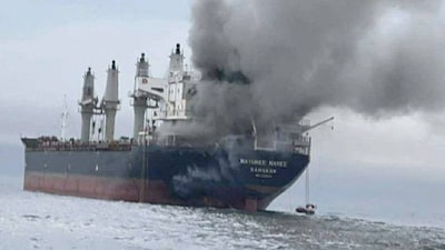 The Thailand-flagged cargo ship Mayuree Naree engulfed in black smoke in the Strait of Hormuz. (Photo Credit: Reuters)