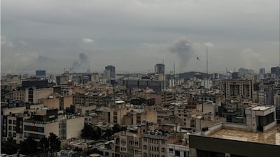 Plumes of smoke rise from the site of a strike in Tehran (Photo: AFP)