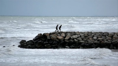 Two men walk on a pier at the southern coast of the Caspian Sea in port city of Bandar Anzali, Iran (Photo: AP)