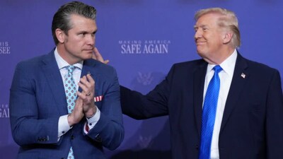 US President Donald Trump speaks with Defense Secretary Pete Hegseth during a roundtable discussion. (X)