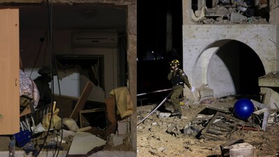 Israeli soldiers work at the scene of damage after Iranian missile barrages struck residential buildings in Arad. (Reuters)