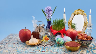 Nowruz, which means ‘new day’ in Persian, is traditionally based on the idea of balance, the moment when day and night are equal, symbolising the triumph of light over darkness.  (Image: Canva)
