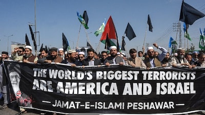 Activists and supporters of the Jamaat-e-Islami party shout slogans during an anti-US and Israel protest in Peshawar after the death of Iran's supreme leader Ayatollah Ali Khamenei amid US-Israel strikes. (IMAGE: AFP)