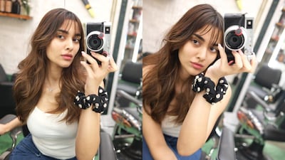 Saiee M Manjrekar unveils a fresh summer look with chic bangs and shorter hair, embracing effortless, playful fashion.