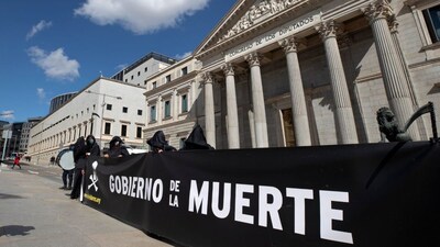 Anti euthanasia protesters stand outside the Spanish Parliament in Madrid, Spain, Thursday. (AP)