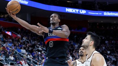 Detroit Pistons center Jalen Duren (0) goes for a layup against Golden State Warriors center Omer Yurtseven, right, during the second half of an NBA basketball game Friday, March 20, 2026, in Detroit. (AP Photo/Duane Burleson)