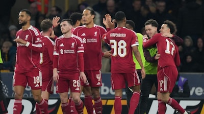 Liverpool's Curtis Jones, right, celebrates with teammates after scoring during the English FA Cup soccer match between Wolves and Liverpool in Wolverhampton, England, Friday, March 6, 2026.(AP Photo/Dave Shopland)