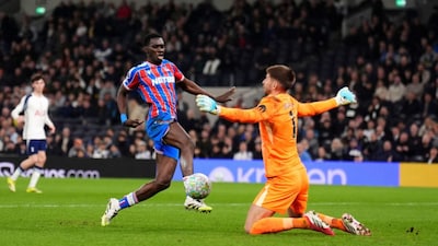 Crystal Palace's Ismaila Sarr, left, scores their third goal of the game during the English Premier League soccer match between Tottenham Hotspur and Crystal Palace in London, Thursday March 5, 2026. (John Walton/PA via AP)