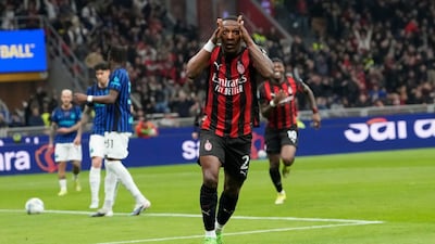 AC Milan's Pervis Estupinan celebrates after scoring the opening goal during the Serie A soccer match between AC Milan and Inter Milan, in Milan, Italy, Sunday, March 8, 2026. (AP Photo/Luca Bruno)