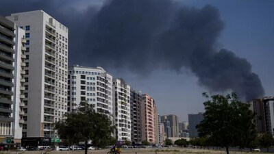 A plume of smoke rises from a warehouse in the Sharjah City in the UAE following reports of Iranian strikes in Dubai on March 1, 2026. (Image credit: AP)