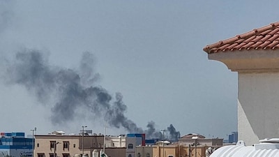 A smoke plume rises over Abu Dhabi from the site of an Iranian missile strike on Saturday (Picture credit: AFP)