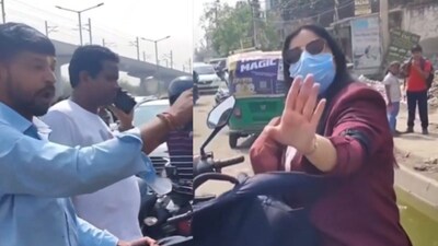 The cab driver is seen holding onto the woman’s bag. (Photo Credit: X)