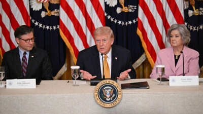 US President Donald Trump with US Speaker of the House Mike Johnson and White House Chief of Staff Susie Wiles, speaks during a lunch with the Kennedy Center Board Members in the East Room of the White House on Monday. (Image: AFP)