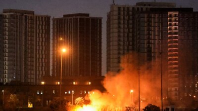 A fire outside the grounds of the US Embassy headquarters in Baghdad's fortified "Green Zone" on March 17  following a drone and rocket attack according to security officials. (Image: AFP File)
