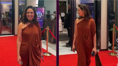 Wearing a sculpted mocha gown, the actor embraced clean silhouettes and dramatic detailing that immediately commanded attention.