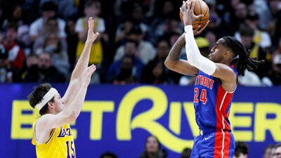 Daniss Jenkins makes a jump shot against Los Angeles Lakers guard Austin Reaves (Picture credit: AP)