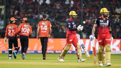 David Payne celebrates with teammates the wicket of Royal Challengers Bengaluru's Jitesh Sharma (Picture credit: AP)