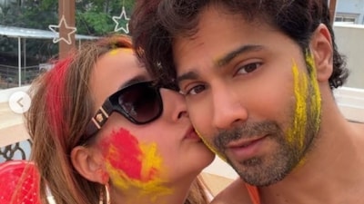 Varun Dhawan Gets A Sweet Kiss From Wife Natasha Dalal During Holi Celebrations | Pics