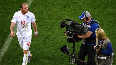 England's striker Wayne Rooney rants to a cameraman at the end of the Group C first round 2010 World Cup football match England vs. Algeria on June 18, 2010 at Green Point stadium in Cape Town (AFP)