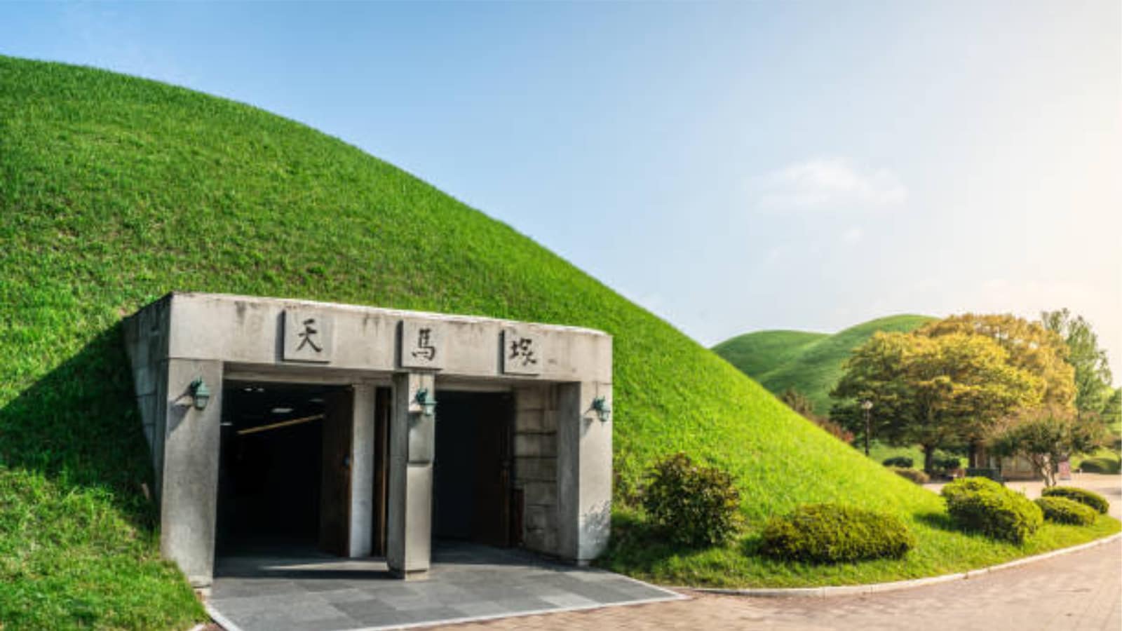 Gyeongju: This place offers a window into Korea before modernity took hold. Once the ancient capital of the Silla kingdom, which ruled for nearly a millennium, the city feels like an open-air museum. The Daereungwon Tomb Complex features vast green fields dotted with enormous royal burial mounds, creating a quietly surreal landscape unlike anywhere else in the country. Gyeongju: This place offers a window into Korea before modernity took hold. Once the ancient capital of the Silla kingdom, which ruled for nearly a millennium, the city feels like an open-air museum. The Daereungwon Tomb Complex features vast green fields dotted with enormous royal burial mounds, creating a quietly surreal landscape unlike anywhere else in the country.