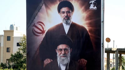 A billboard depicting Iran’s slain supreme leader Ayatollah Ali Khamenei and his son, Mojtaba Khamenei. (AFP)