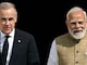 Prime Minister Narendra Modi walks with his Canadian counterpart Mark Carney before their meeting at the Hyderabad House in New Delhi on March 2. (AFP photo)