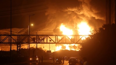 Iran was covered in black smoke and toxic rain after Israeli strikes on one of its oil refineries. (Reuters)