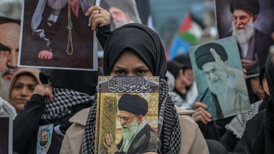 A protestor holds a portrait of Ayatollah Ali Khamenei during a demonstration against the US and Israel attack of Iran and the killing of the Supreme leader in front of Israel Consulate in Istanbul. (AFP)