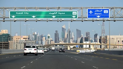 Vehicles drive along the highway leading to and from Kuwait City on March 2, 2026. (File Photo: AFP)