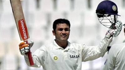 Virender Sehwag celebrates after scoring his first-ever triple century in the 2004 Test match against Pakistan in Multan. (Image: ICC/X, formerly Twitter)